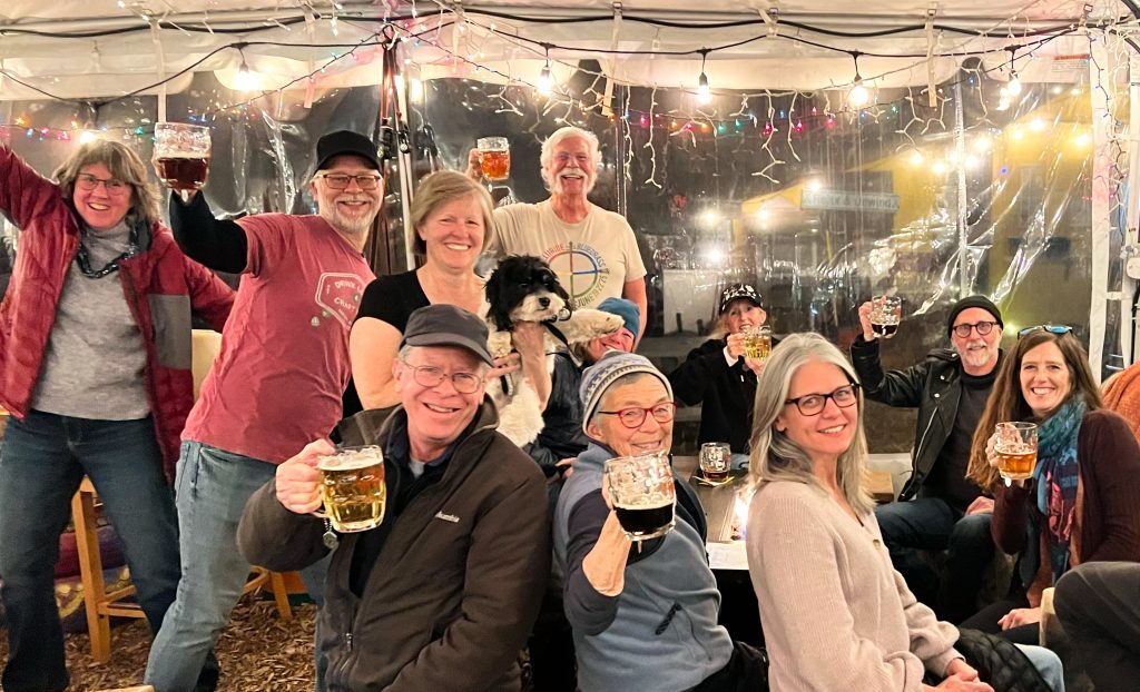cheers people in tent at Strange Craft BV in the BV Backyard